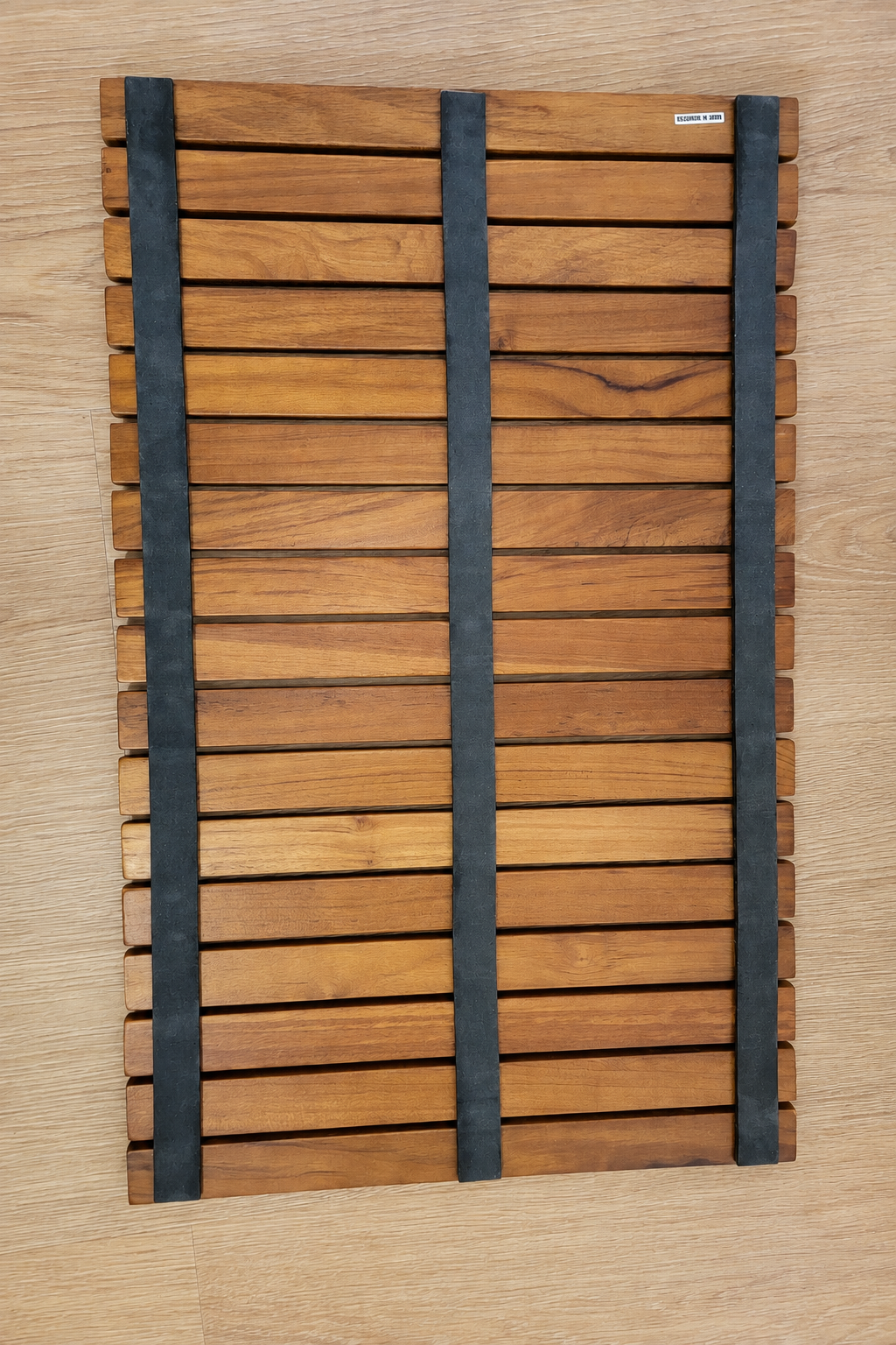 Teak mat laid inside an RV shower