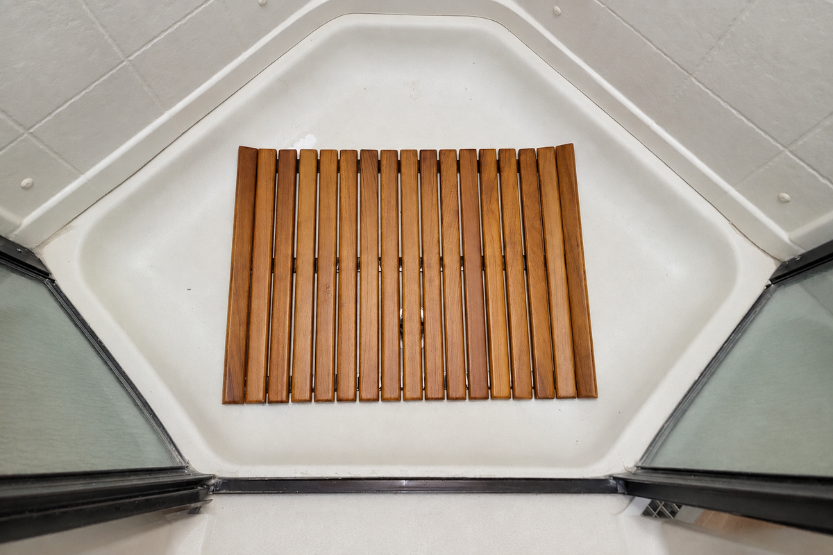 Teak mat rolled upright for compact storage